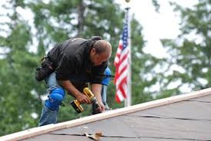 Picture or roofer with nailgun