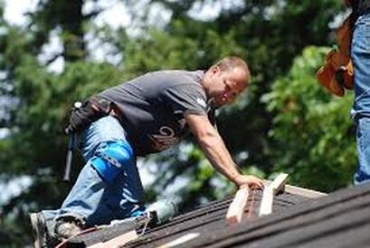 Picture of roofer putting on roof