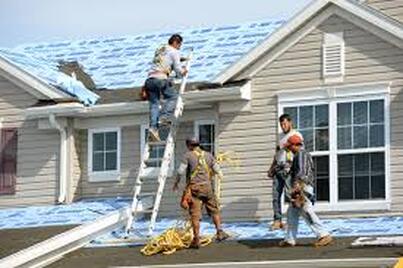 Picture of roofer on ladder 
